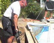 Removing the concrete footing on a rusted steel wall Pool 